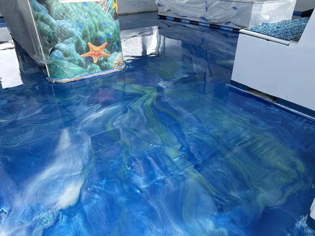 Blue metallic epoxy floor coating on boat