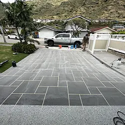 UV resistant epoxy driveway coating in progress on Hawaii residence
