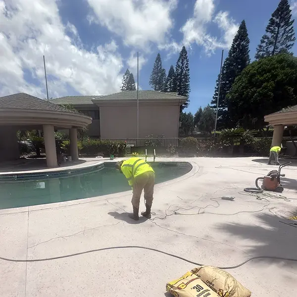 Concreate Oahu installing concrete coating on pool deck
