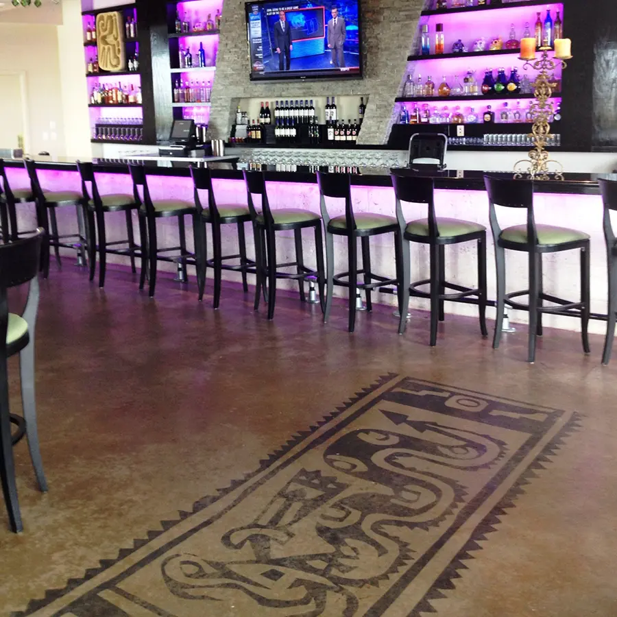 Custom concrete coating on floor of high-end bar
