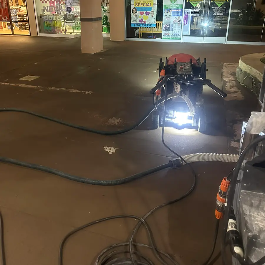 Concrete Polishing machine being prepared to run outside of closed business