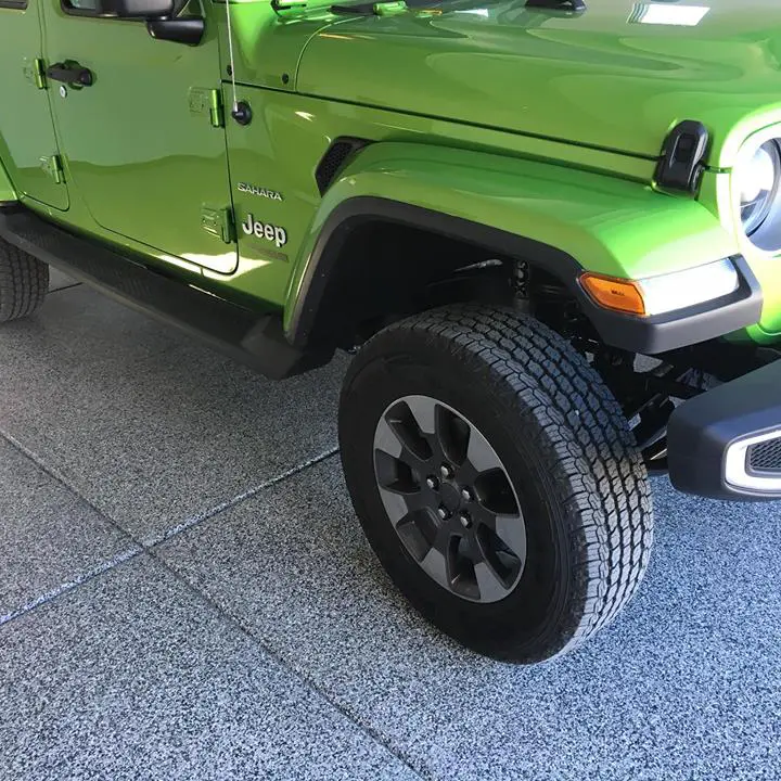 Green Jeep in garage with flake floor coating