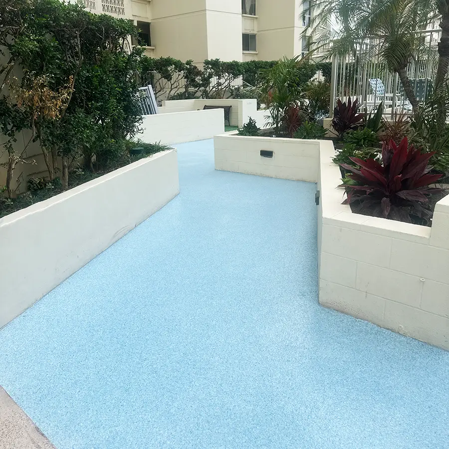 Non-slip outdoor coating on walkway at multi-family residential building