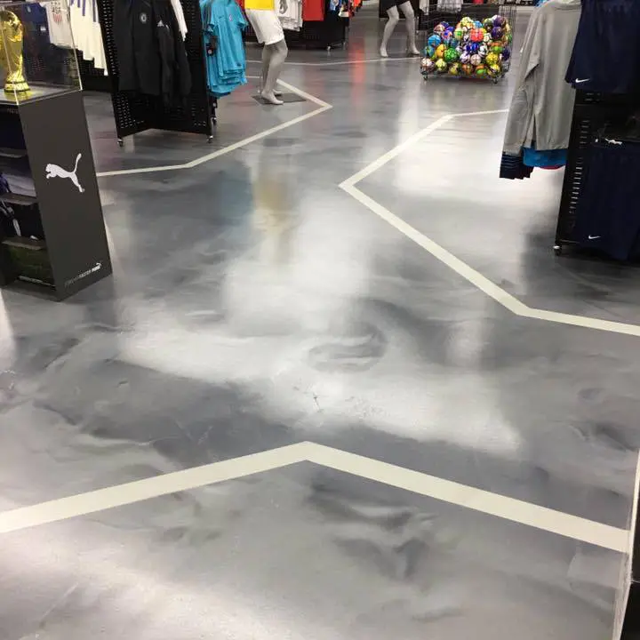 Sports retail business with metallic silver epoxy floor coating